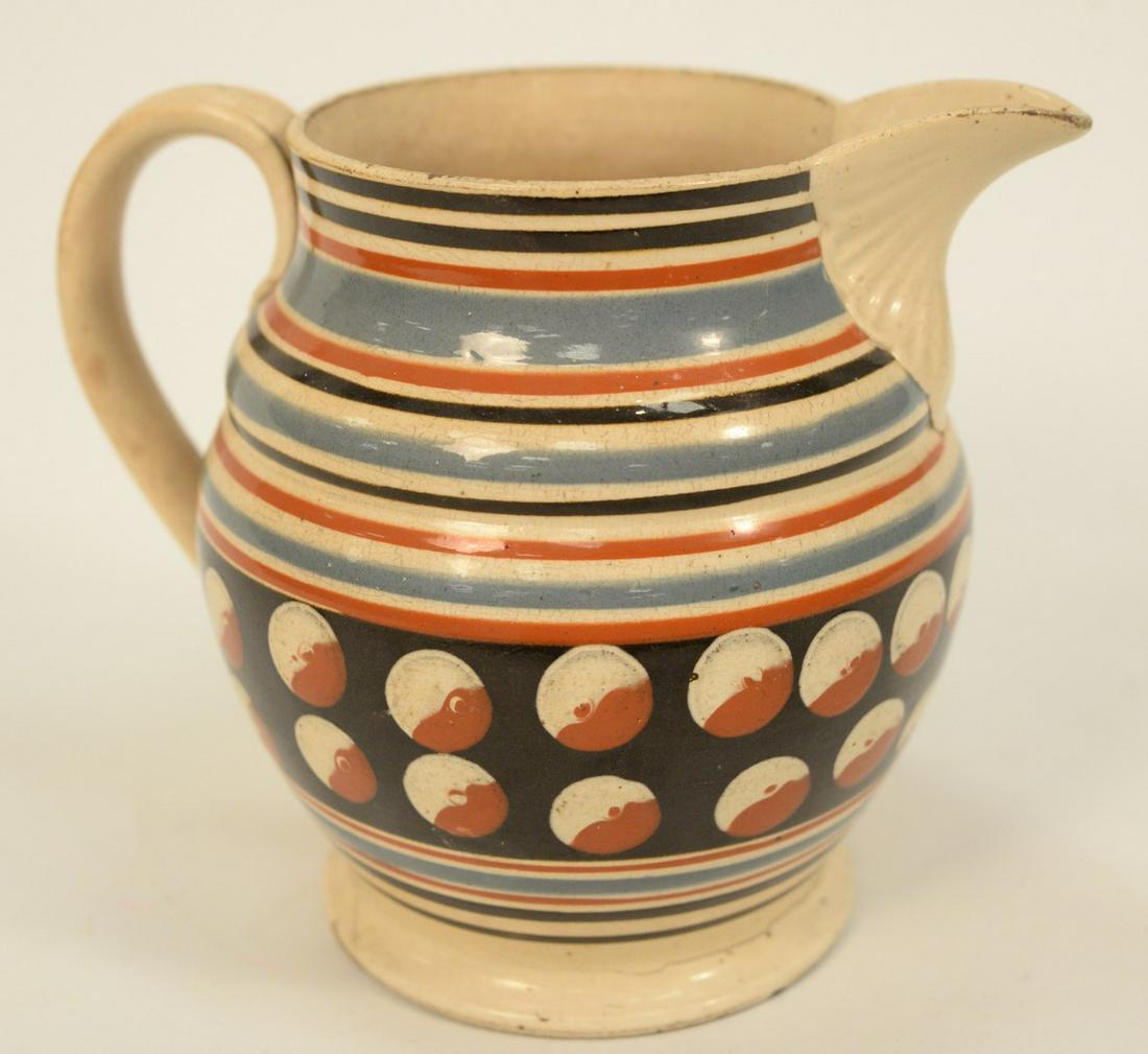 Mocha Jug with Large Spout, slip banding and cat eyes: Mocha Jug with Large Spout, slip banding and cat eyes on footed base (crack at foot).height 6 7/8 inches.Provenance: Estate of Michael Coe, PhD, New Haven, Connecticut.