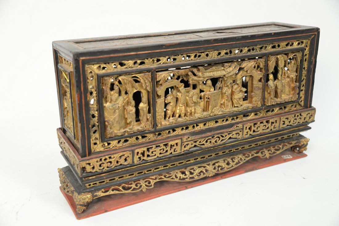 Chinese Gilt and Lacquered Carved Wood Panel Box or: Chinese Gilt and Lacquered Carved Wood Panel Box or Stand set on dragon head feet.height 10 inches, 4 3/4" x 17 3/4".Provenance: From the Robert Circiello Collection, West Hartford, Connecticut.