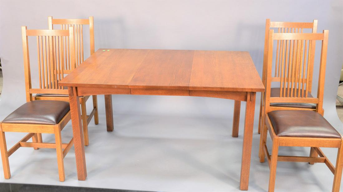 Stickley five piece set, square table with four side: Stickley five piece set, square table with four side chairs having leather seats, two leaves, table ht. 30", chair ht. 41", top 36" x 51".