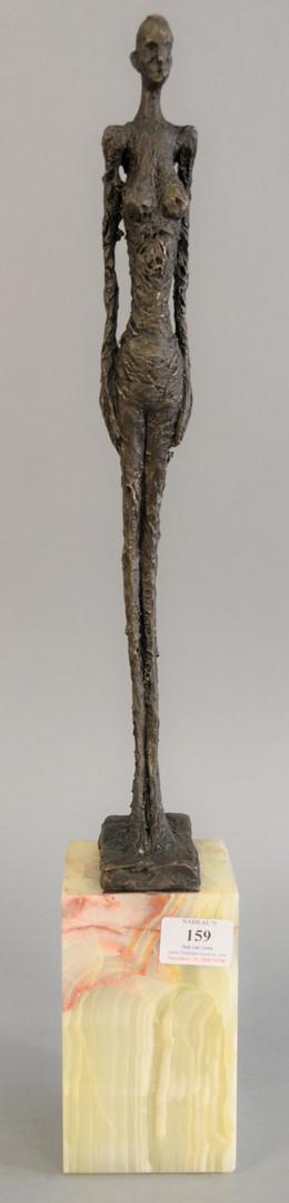 After Alberto Giacometti (Swiss, 1901-1966), thin: After Alberto Giacometti (Swiss, 1901-1966), thin woman, Mid-century bronze on alabaster base, marked 'Giacometti' on the base, 24 1/2" x 3 3/4" x 3 1/2".