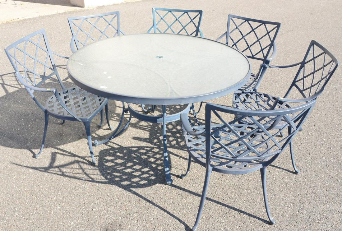 Twelve piece outdoor lot to include round glass top: Twelve piece outdoor lot to include round glass top table, six chairs, loveseat, and four miscellaneous tables.