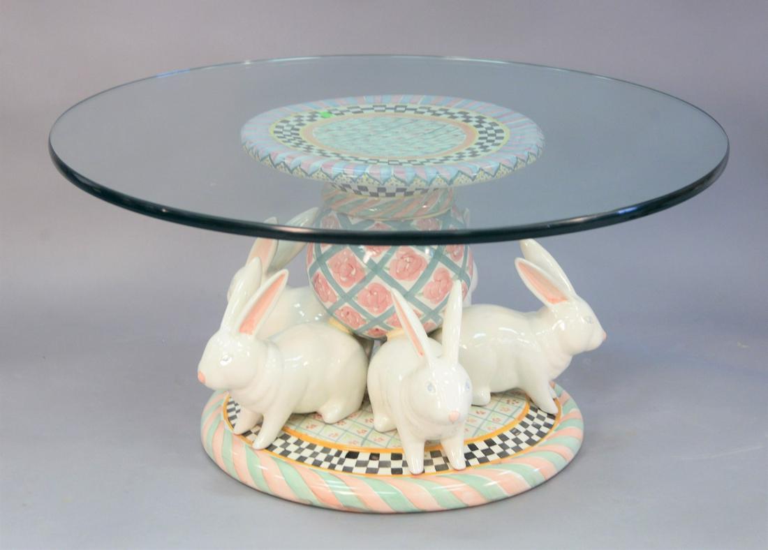 Two piece lot, to include, Mackenzie Childs coffee: Two piece lot, to include, Mackenzie Childs coffee table, hand painted ceramic pottery featuring rose cottage floral pattern and white rabbits around the base with a glass top, ht. 18", along with a b
