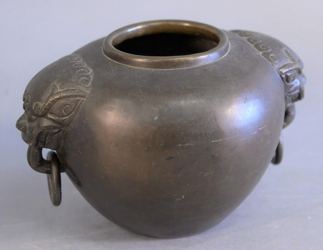 Chinese bronze incense holder, foo dogs and ring: Chinese bronze incense holder, foo dogs and ring handles, 4-1/2" high. Provenance: The Estate of Ed Brenner, Short Hills, New Jersey.