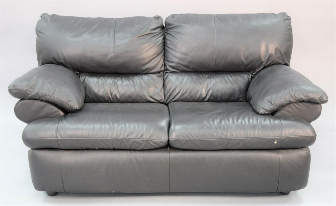 Black leather two-cushion loveseat, ht. 37", wd. 66",: Black leather two-cushion loveseat, ht. 37", wd. 66", dp. 36".