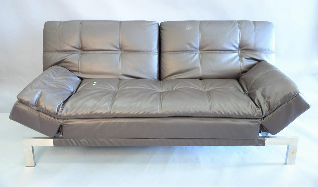 Contemporary brown leather folding sofa, folds down: Contemporary brown leather folding sofa, folds down into bed on chrome legs, ht. 38" x wd. 80" x dp. 37".