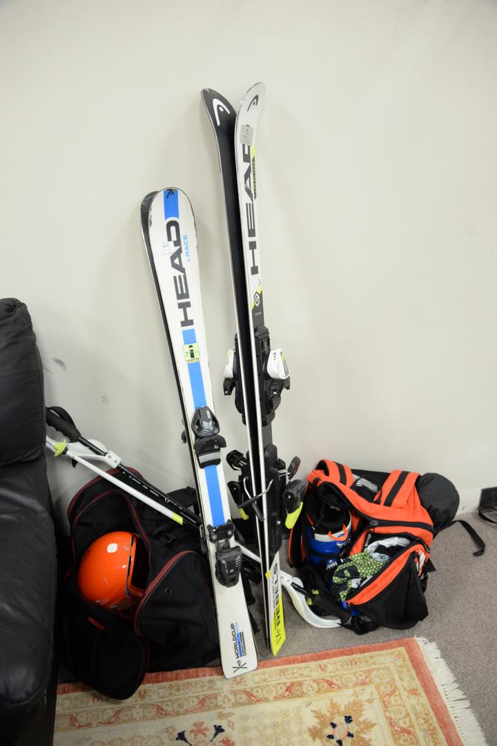 Group of two kids World Cup snow skis, boots, helmets: Group of two kids World Cup snow skis, boots, helmets and poles, varying sizes.