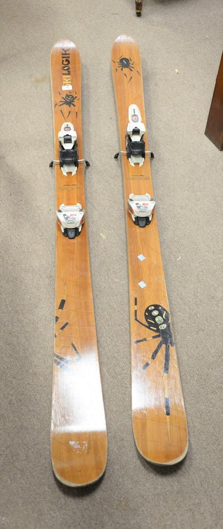 Pair of wood veneer snow skis made by Skilogik, model: Pair of wood veneer snow skis made by Skilogik, model "Ullr's Chariot 178" with large spider detail, lg. 68 1/2".