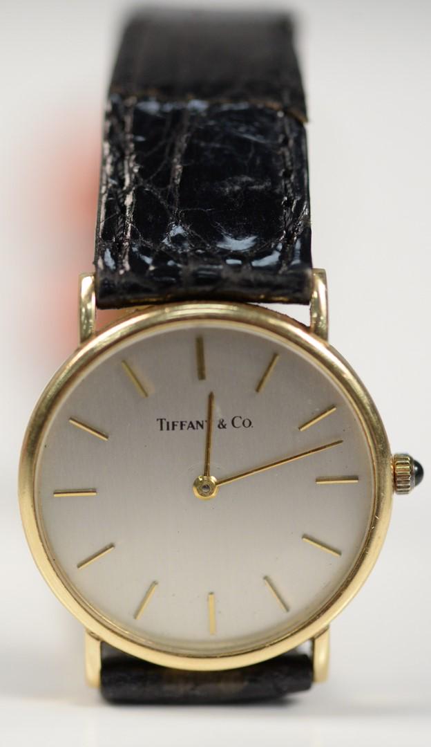 Tiffany & Company 14 Karat Gold Men's Wristwatch with: Tiffany & Company 14 Karat Gold Men's Wristwatchwith 14 karat gold, and leather band30.5 millimetersProvenance: The Estate of Andrew Wolf, New Haven, Connecticut, Arts Chief