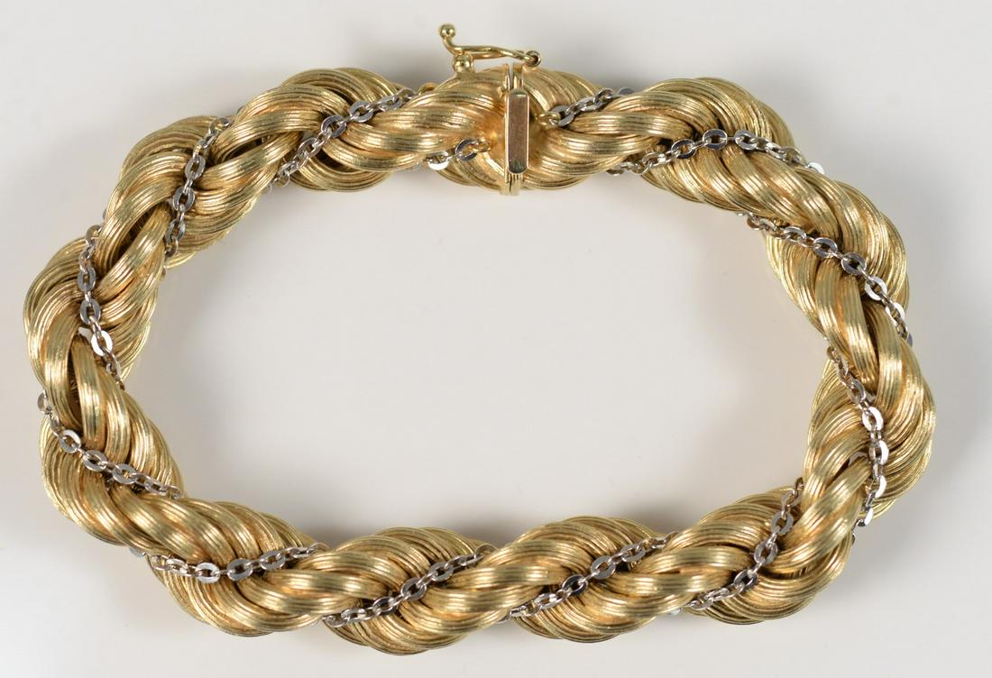 14 Karat Gold Bracelet twist design, with small white: 14 Karat Gold Bracelet twist design, with small white gold chain woven in length 7 3/4 inches 32.6 grams