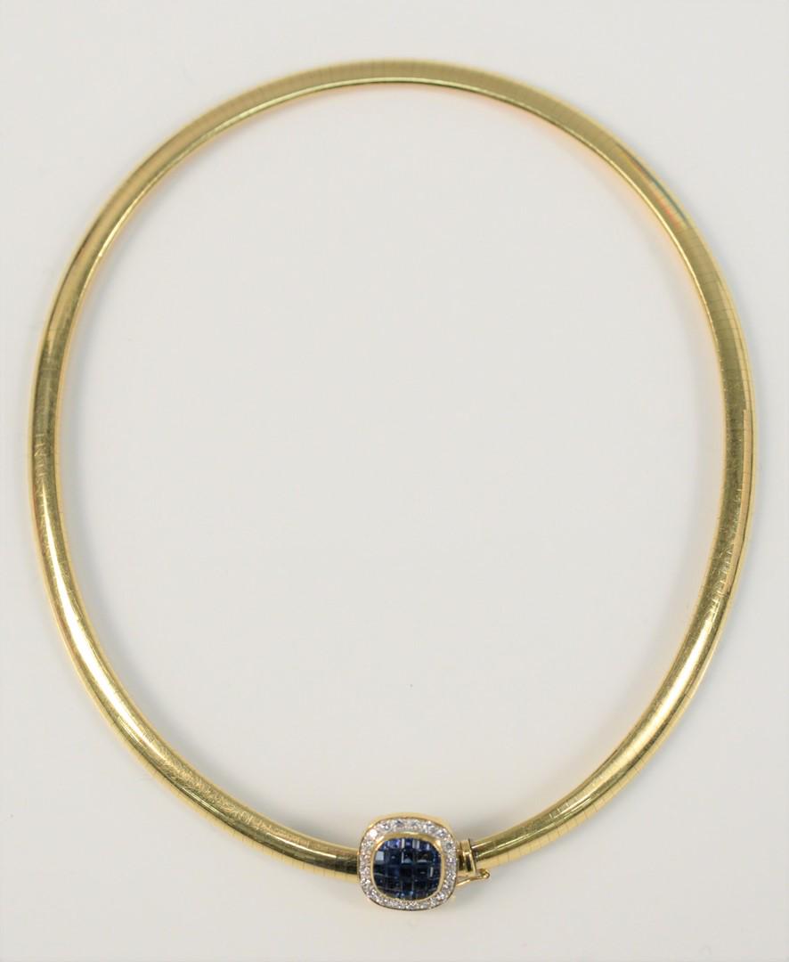 Omega 18 Karat Gold Necklace having slide set with blue: Omega 18 Karat Gold Necklacehaving slide set with blue sapphires, surrounded by diamonds47.1 grams
