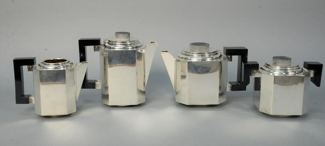 Modernism Style Sterling Silver four piece tea and: Modernism Style Sterling Silver four piece tea and coffee service, having square design, and wood handles, tallest height 7 1/4 inches,101.6 troy ouncesProvenance: The Estate of Alina Roisen, Park Ave