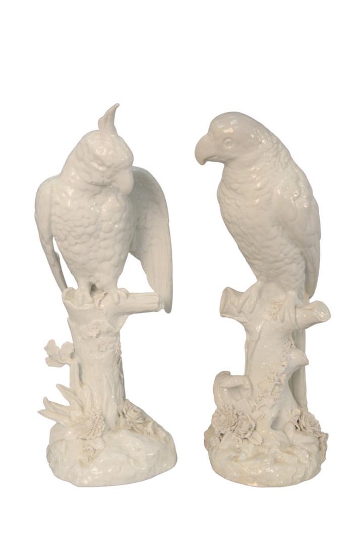 Pair of German Porcelain Parrots sitting on tree: Pair of German Porcelain Parrotssitting on tree stumps, Blanc de Chine with blue crossed swords, mark on bottom, impressed 'A' possibly Meissenheight 14 1/2 inches