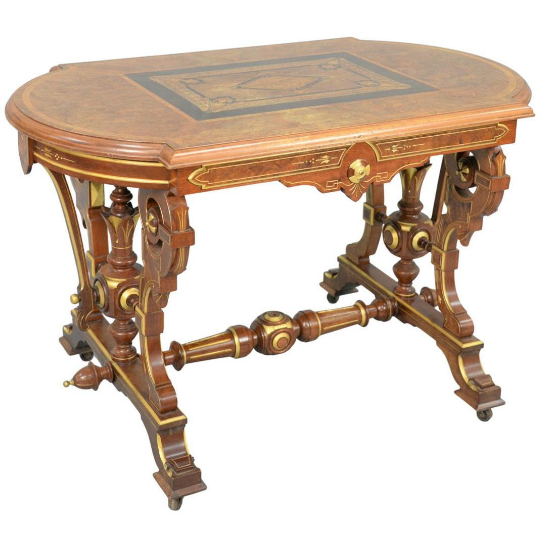 Renaissance Revival Center Table with inlaid burlwood,: Renaissance Revival Center Tablewith inlaid burlwood, shaped top on gilt decorated base and stretcherheight 29 inches, top 27 1/2" x 46"Provenance: Thirty-five year collection of Dana Cooley, Old Lyme