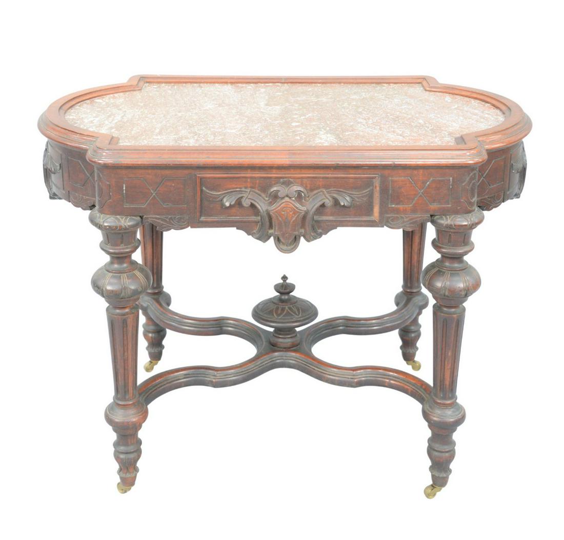 Victorian Walnut Center Table with brown inset marble: Victorian Walnut Center Tablewith brown inset marble height 30 1/2 inches, top 25 1/2" x 41 1/2"Provenance: Thirty-five year collection of Dana Cooley, Old Lyme, Connecticut