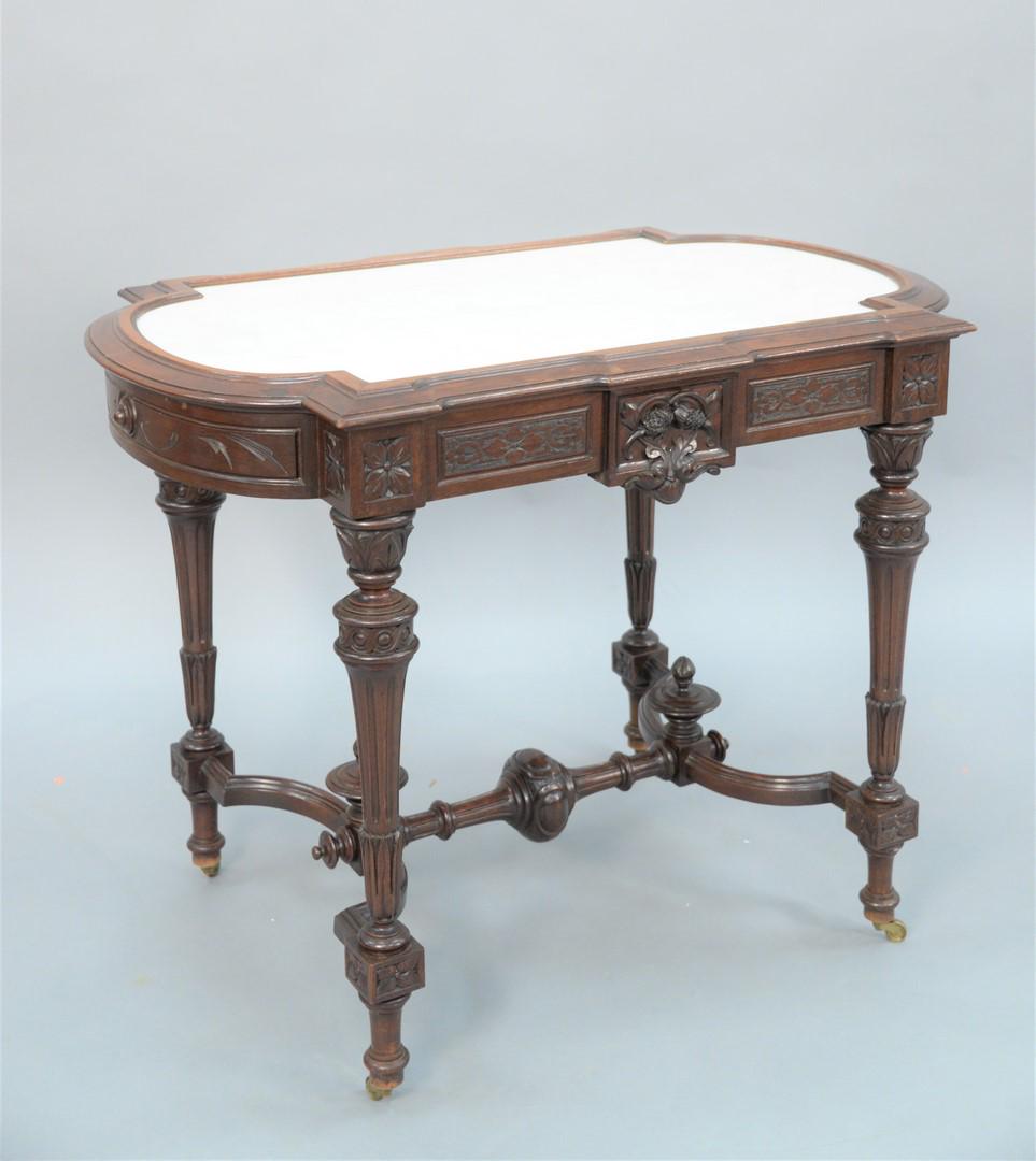 Renaissance Revival Walnut and Burl Walnut Table with: Renaissance Revival Walnut and Burl Walnut Tablewith inset white marble on square supports, set on downswept members, with stretcher and urnsheight 29 1/2 inches, top 30" x 36 1/2"Provenance: Thirty-f