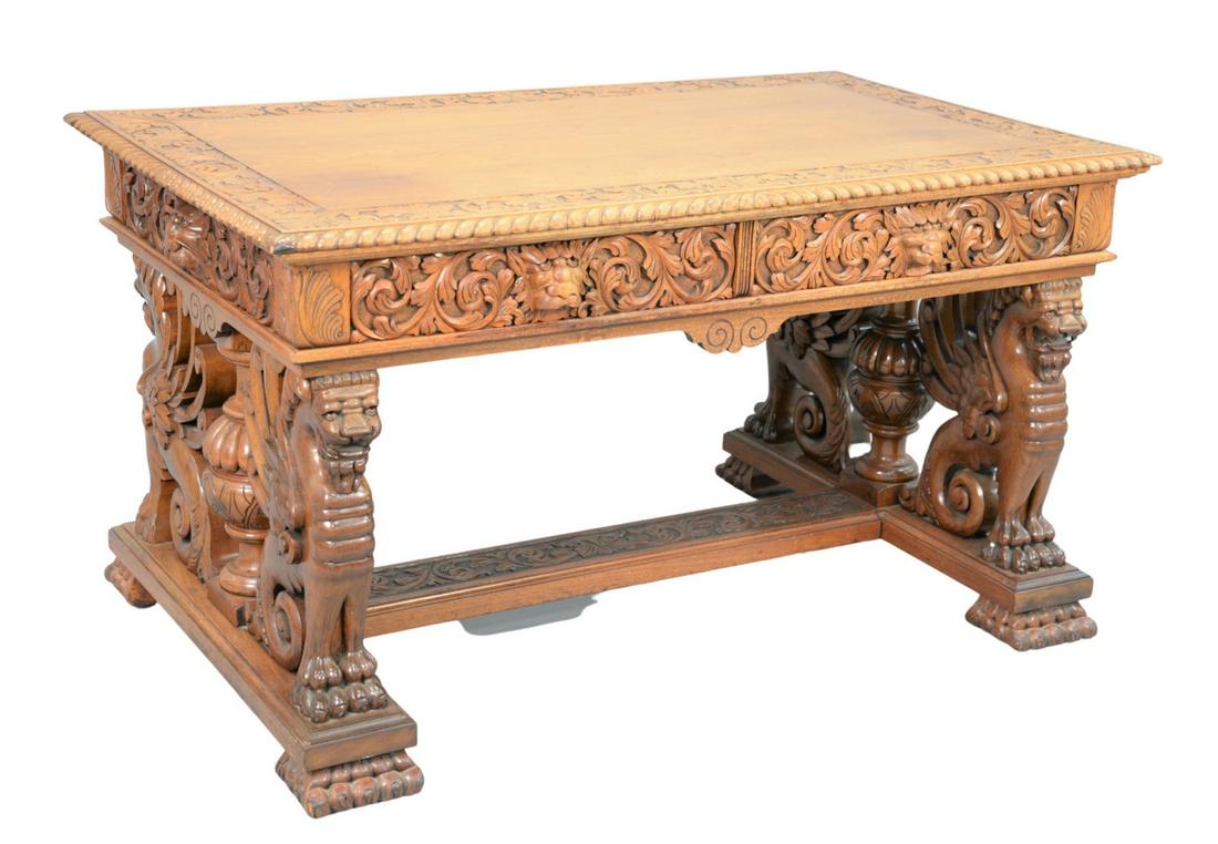 Victorian Walnut Winged Griffin Partners Desk having: Victorian Walnut Winged Griffin Partners Deskhaving oak leaf carved top, in rope edge over two drawers, and two false drawers with carved scrolls, lion marks on winged griffin supports, with urns and 