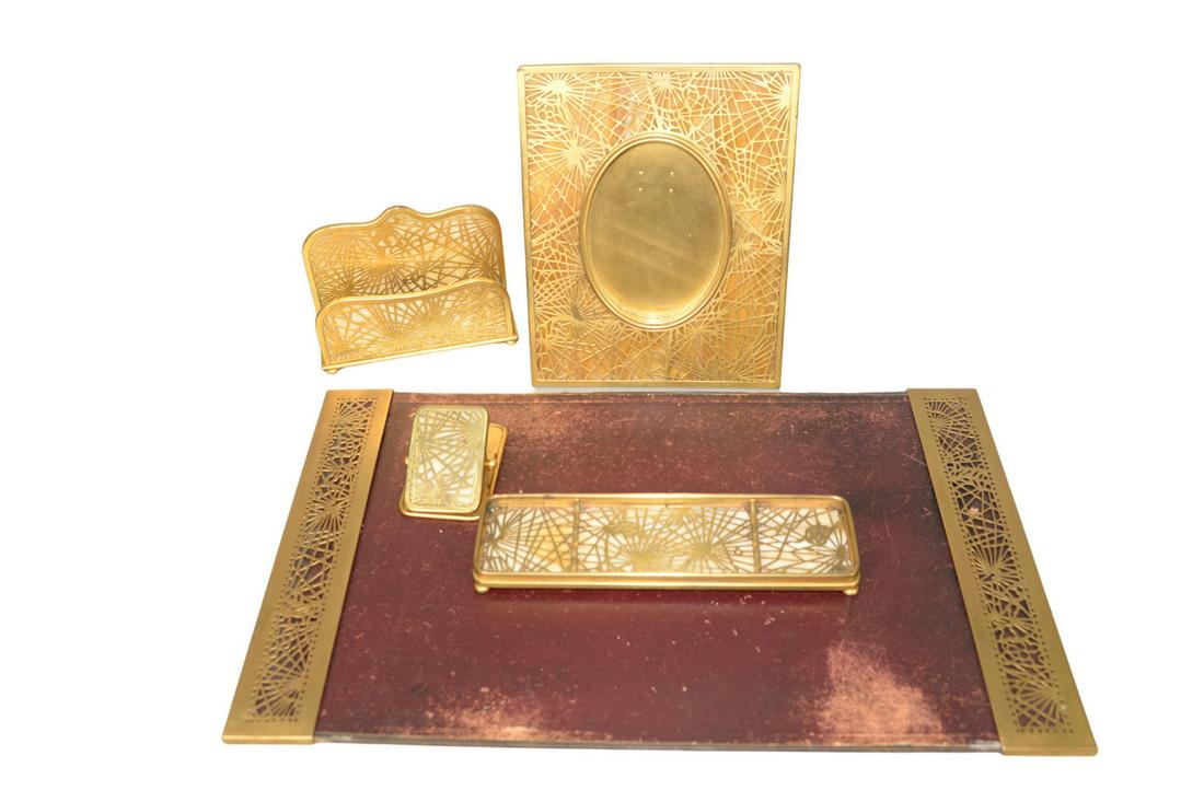 Five Piece Tiffany Studios Desk Set with blotter ends,: Five Piece Tiffany Studios Desk Setwith blotter ends, letter holder, picture frame, pen tray, and large clip#1004, 971, 946, 1019 and 998height of blotter ends 12 inches (missing glass)height of frame