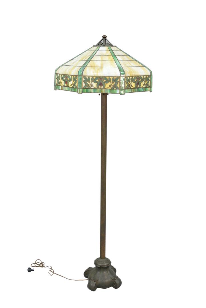 Floor lamp with leaded shade with leaves and red desig: Floor lamp with leaded shade with leaves and red designs, four socket, all with acorn pulls,Attributed to Handel.ht. 65 1/2 inches, dia. 25 inches.