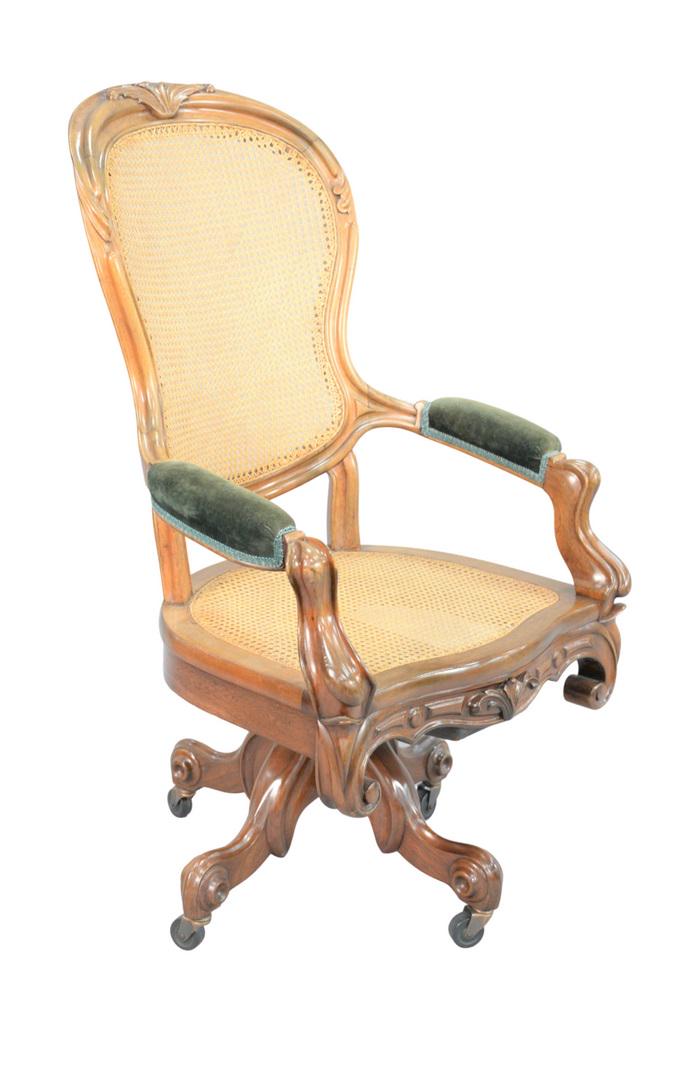 Victorian Walnut Swivel Office Chair with caned back: Victorian Walnut Swivel Office Chairwith caned back and seatheight 47 inchesProvenance: Matthes-Theriault Collection, Woodbridge, Connecticut