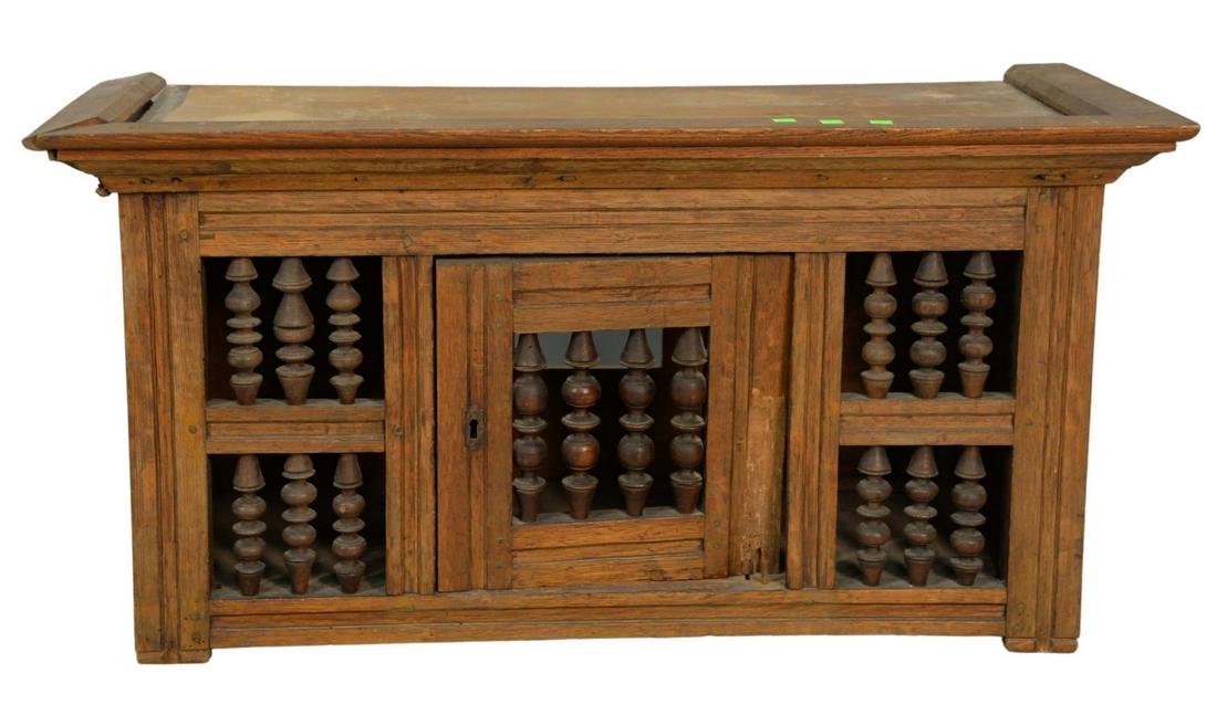 Oak Joined Cabinet with spool door early 18th Century: Oak Joined Cabinetwith spool doorearly 18th Centuryheight 21", top 16 1/2" x 41"(restored)Provenance: The Estate of Diana Atwood Johnson