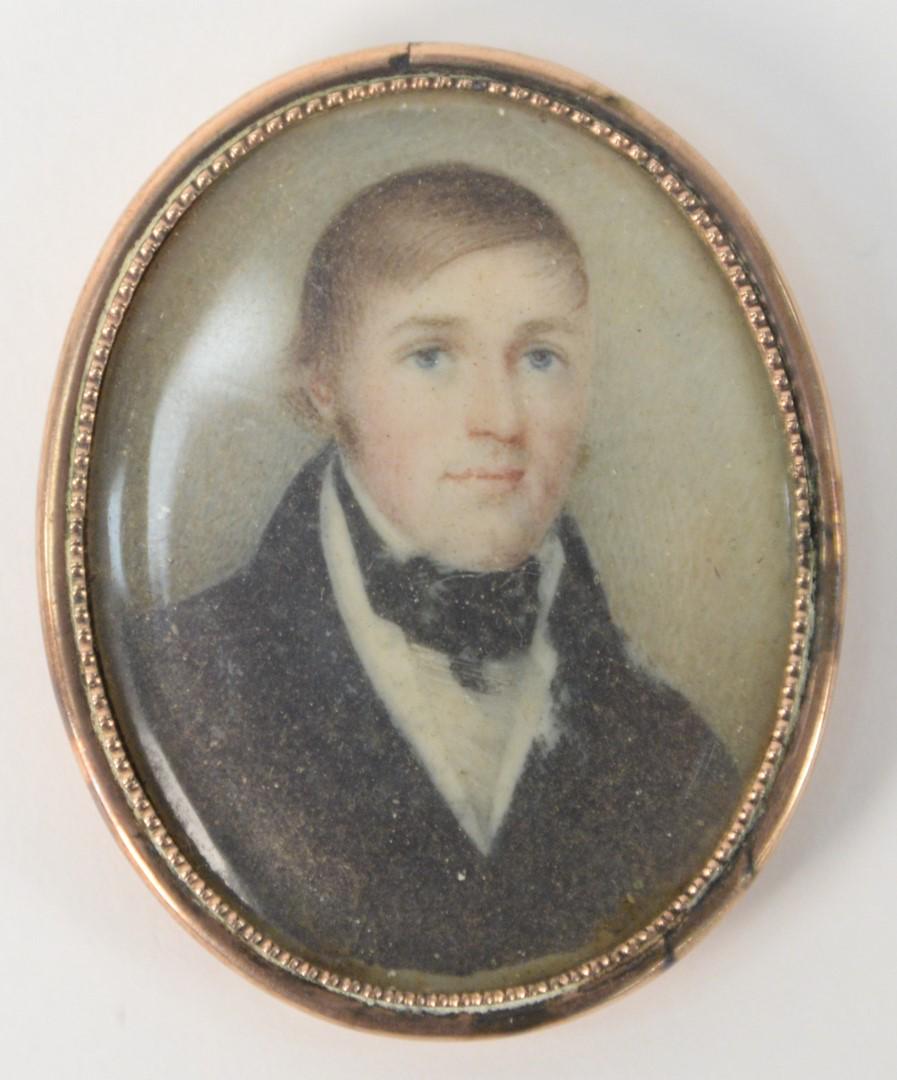 Miniature Painting of a Gentleman, in a gold case with: Miniature Painting of a Gentleman, in a gold case with hair in back; pin missing2" x 1 1/2". Provenance: From the Lance & Irma Keller Collection, Bloomfield, Connecticut.