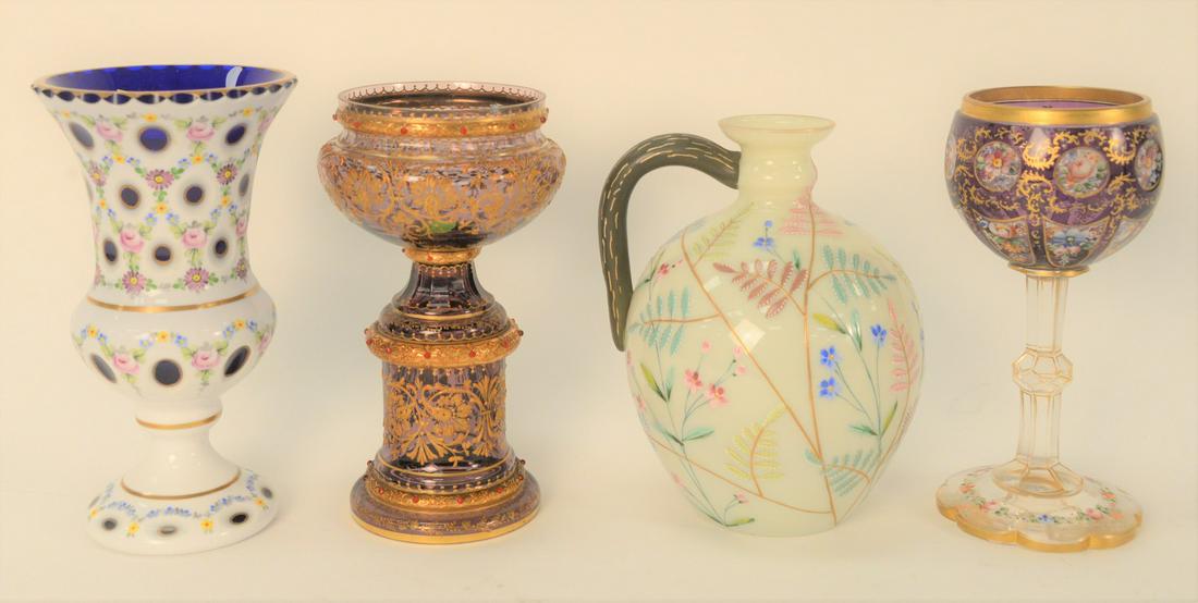 Four Piece Group, to include an enameled white cut to: Four Piece Group, to include an enameled white cut to cobalt vase; a white enameled pitcher with handle; a purple glass compote with gold enameling, possibly Moser; a Moser stemmed chalice with enamel