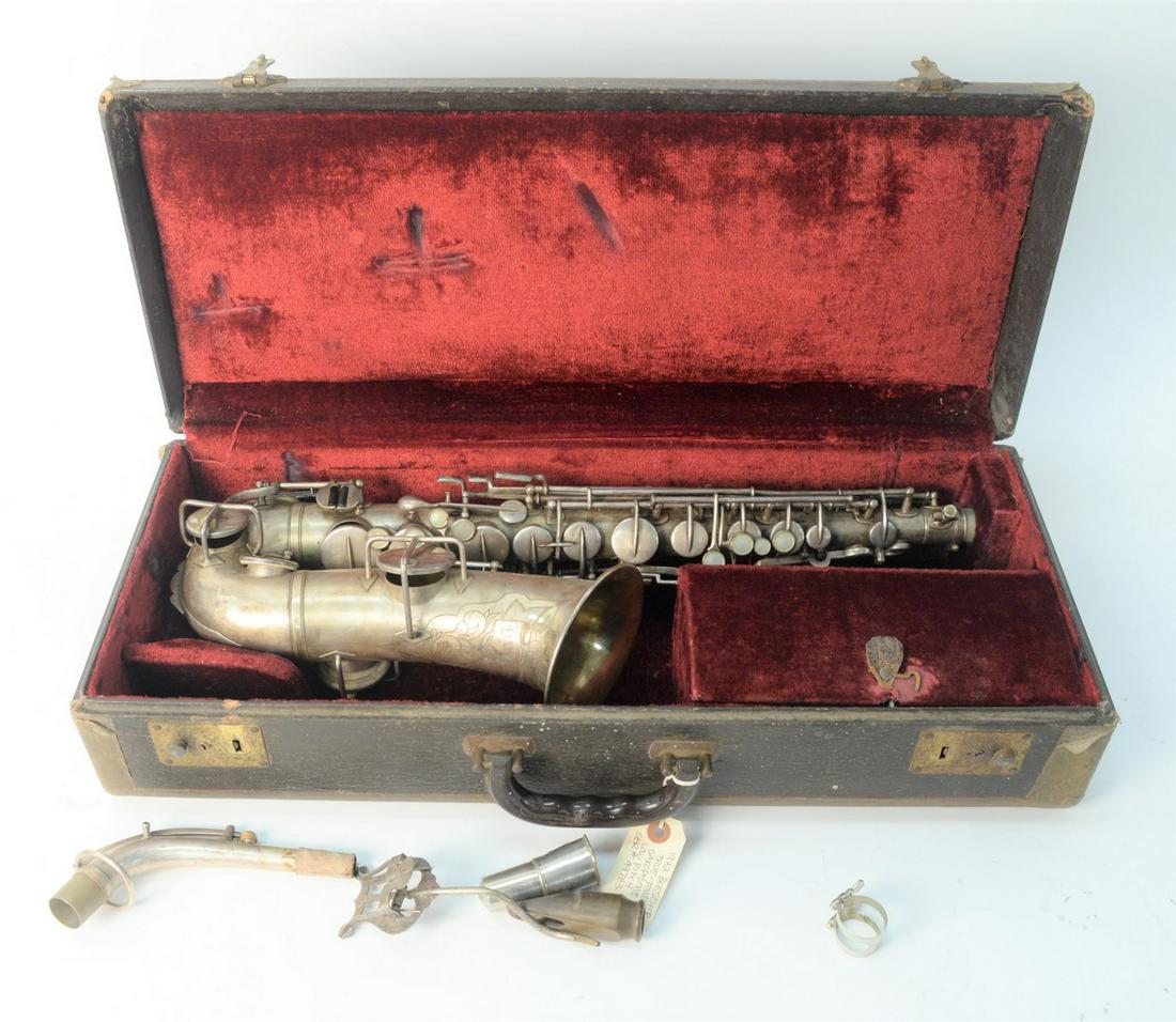 1922 Buescher Alto Saxophone, serial #99783, pads and: 1922 Buescher Alto Saxophone, serial #99783, pads and springs in good shape, Trutone c-melody, hard-shell case, length 25 1/2 inches.