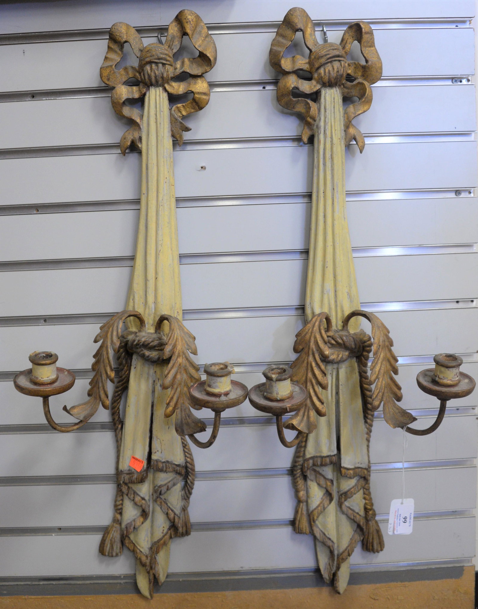 Pair of French Gilt Metal and Carved Painted Wood Two: Pair of French Gilt Metal and Carved Painted Wood Two Light Sconces, in the form of a drape with curtain ties, height 32 inches.