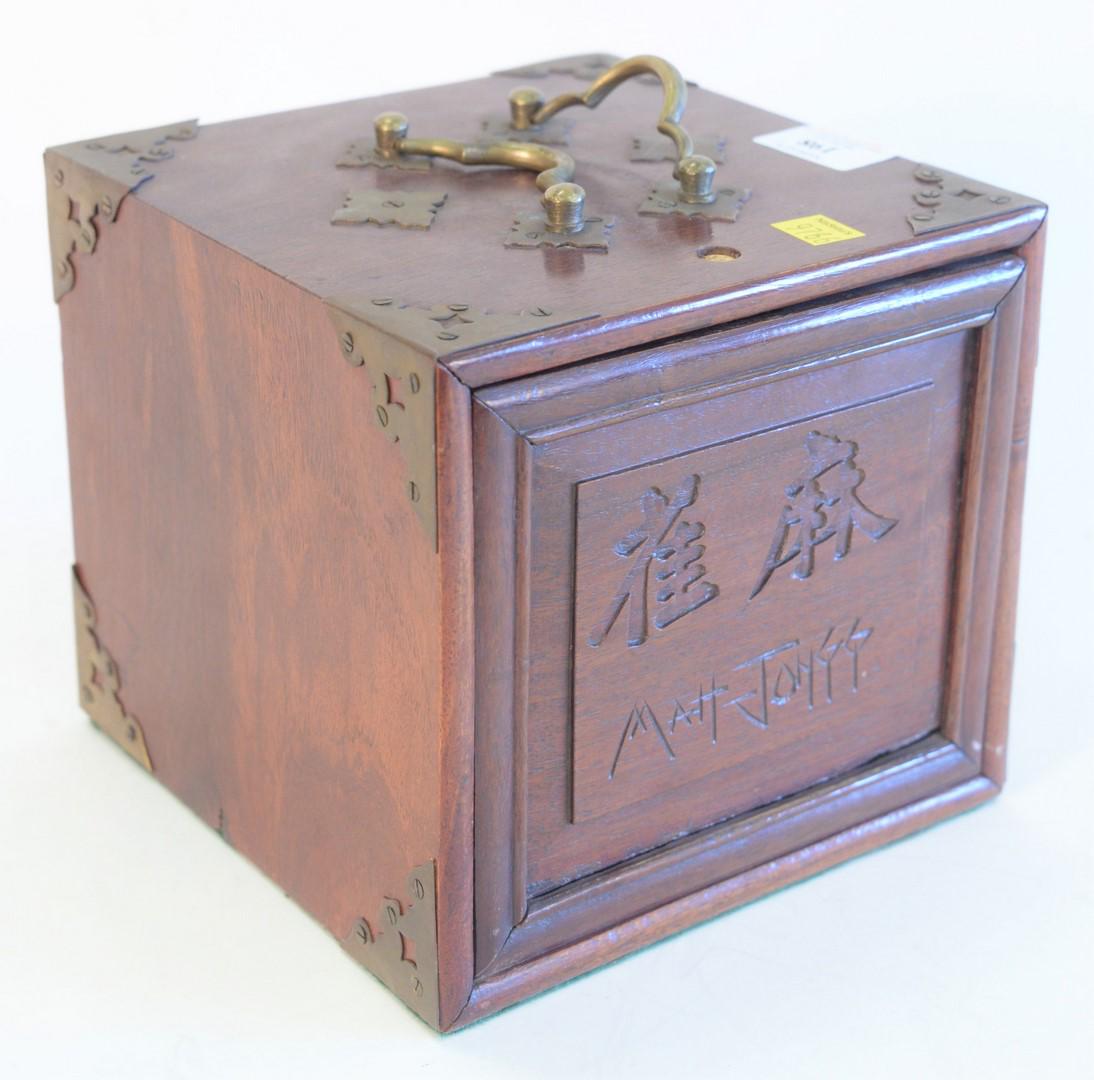 Chinese Bone Mahjong Set, in wooden locking box with: Chinese Bone Mahjong Set, in wooden locking box with brass details and handles, height 7 1/2 inches, width 7 1/2 inches, depth 8 inches.