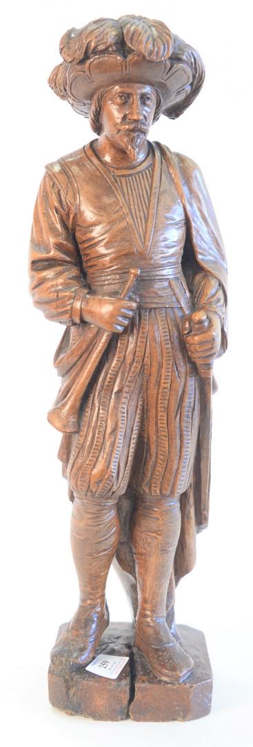 Carved figure of a European Figure, wearing a hat with (1 of 4)