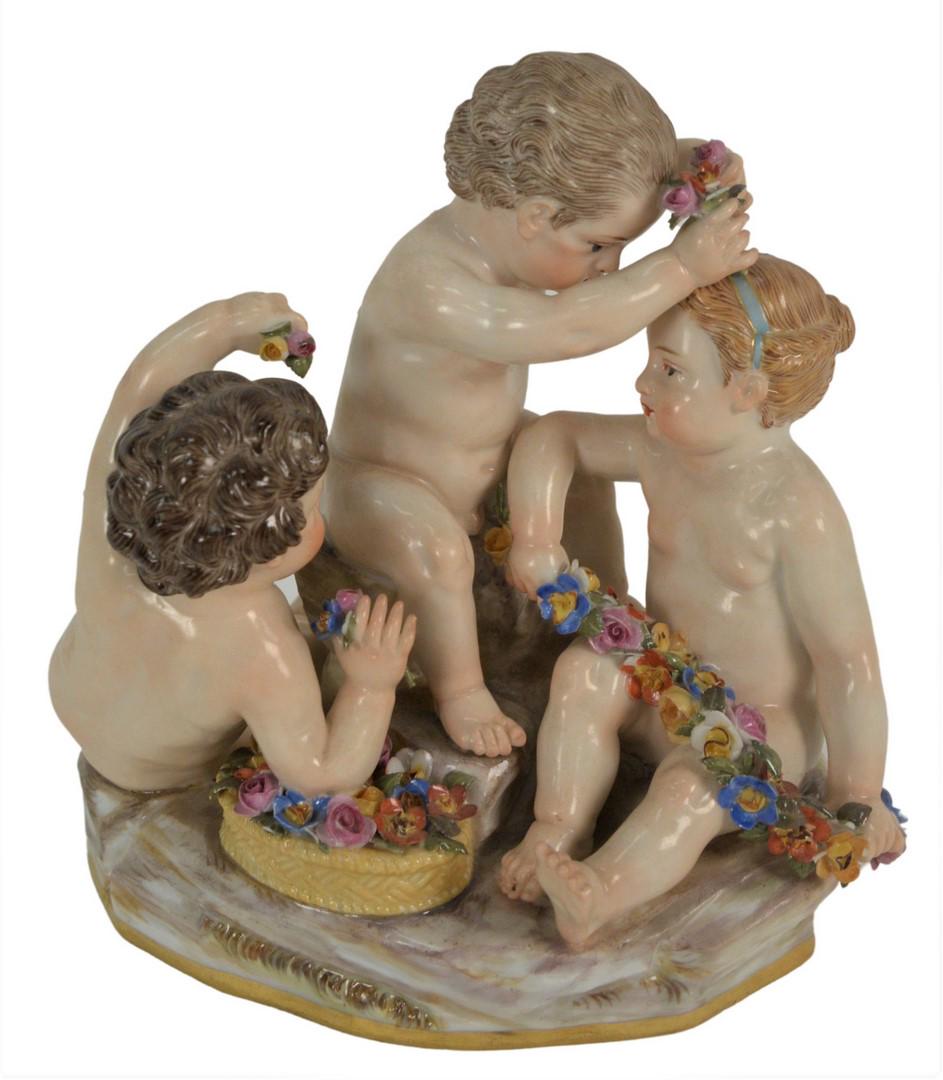 Meissen Figural Group having three puttis with flowers,: Meissen Figural Group having three puttis with flowers, (minor losses), height 5 inches, width 5 inches.
