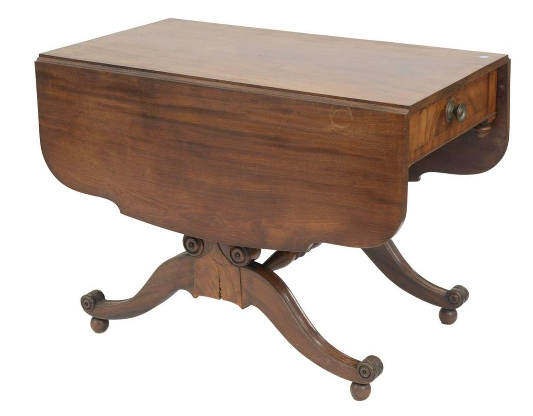 Duncan Phyfe Mahogany Table, having shaped drop leaves: Duncan Phyfe Mahogany Table, having shaped drop leaves with drawer on shaped supports set on four downswept members rested on ball feet, circa 1820, height 29 inches, top closed 21 1/2" x 40", open 40
