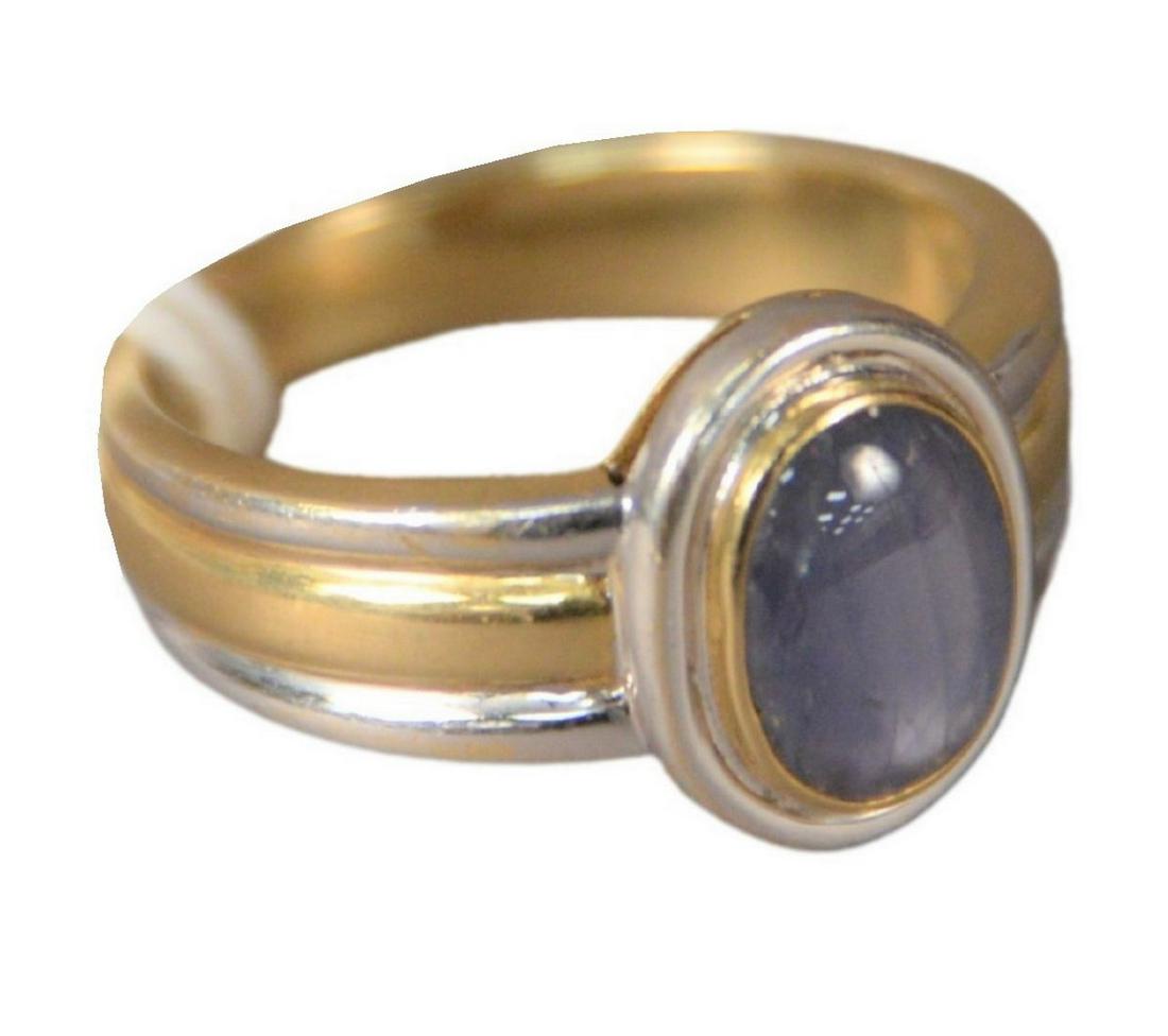18 Karat White and Yellow Gold Ring, set with star: 18 Karat White and Yellow Gold Ring, set with star sapphire, size 9, 9.2 grams.
