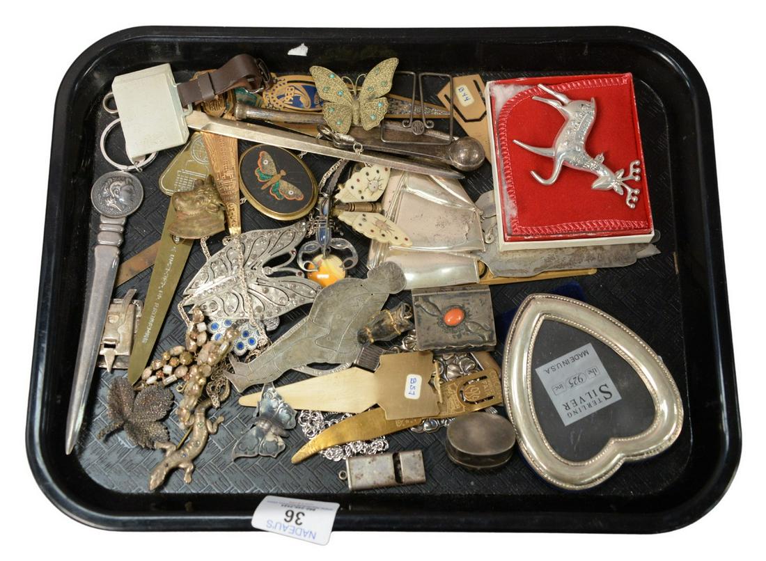Group Lot of Items, to include Gorham sterling schooner;: Group Lot of Items, to include Gorham sterling schooner; Tiffany and Company letter opener; book page placeholders; Wallace sterling pendant; Toppan figure; sterling whistles; sterling butterfly; cost