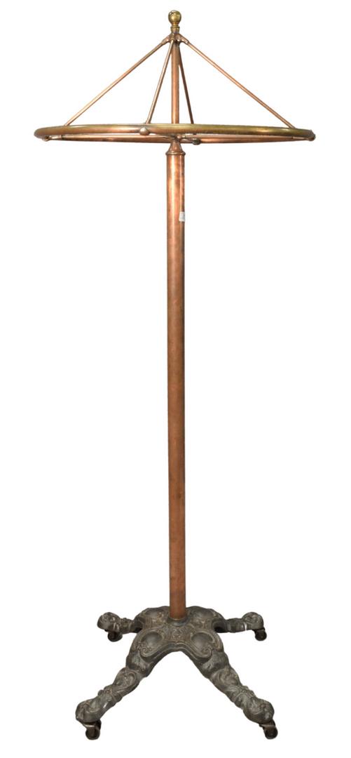 Victorian Brass Clothing Rack, on iron base, height 78: Victorian Brass Clothing Rack, on iron base, height 78 inches, diameter 30 inches.