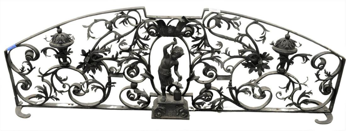 Cast Iron Figural Fire Fender, having scrolling: Cast Iron Figural Fire Fender, having scrolling acanthus leaves with iron worker in center, height 16 1/2 inches, length 48 inches.
