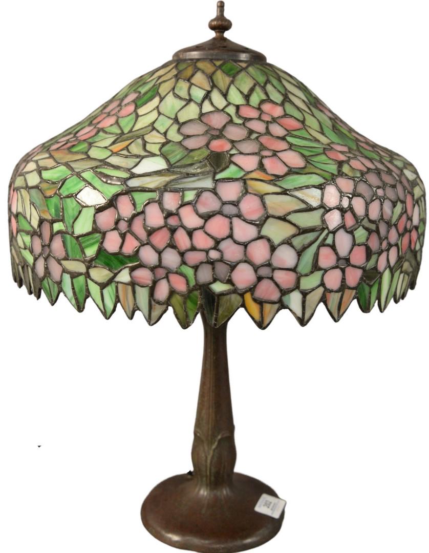 Handel Leaded Glass Table Lamp, having apple blossom: Handel Leaded Glass Table Lamp, having apple blossom shade, marked Handel on bronze base, with two sockets, height 20 1/2 inches, diameter 16 inches.
