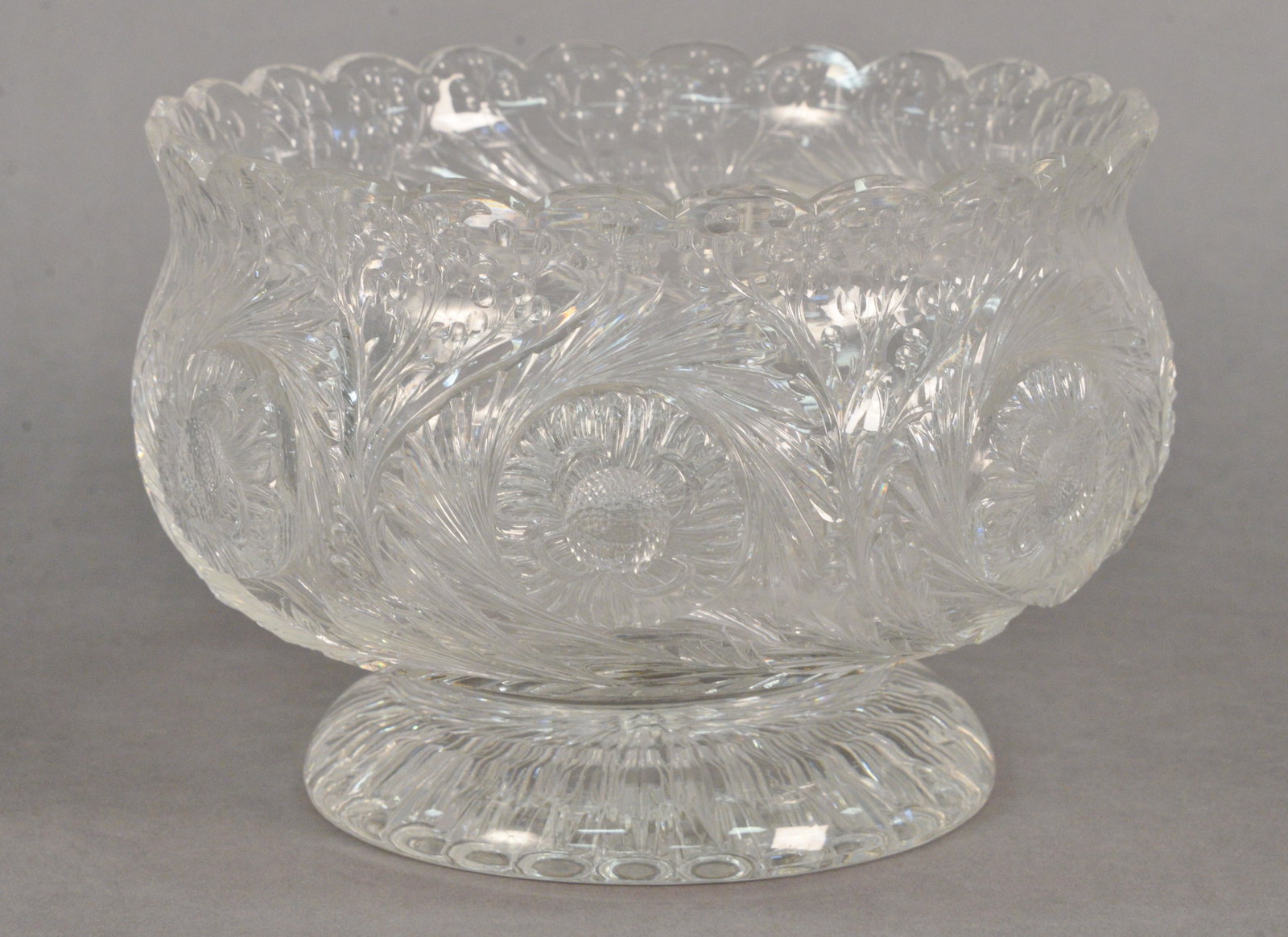 Thomas Webb Engraved Rock Crystal Style Footed Bowl,: Thomas Webb Engraved Rock Crystal Style Footed Bowl, having seven engraved flowers amongst spiral flutes, resting on round engraved base, height 6 1/2 inches, diameter 9 1/4 inches.
