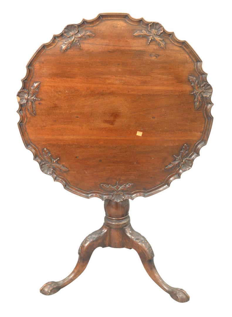 Georgian Mahogany Tip Table, having carved top on large: Georgian Mahogany Tip Table, having carved top on large pedestal on tripod base, height 28 inches, diameter 30 inches.