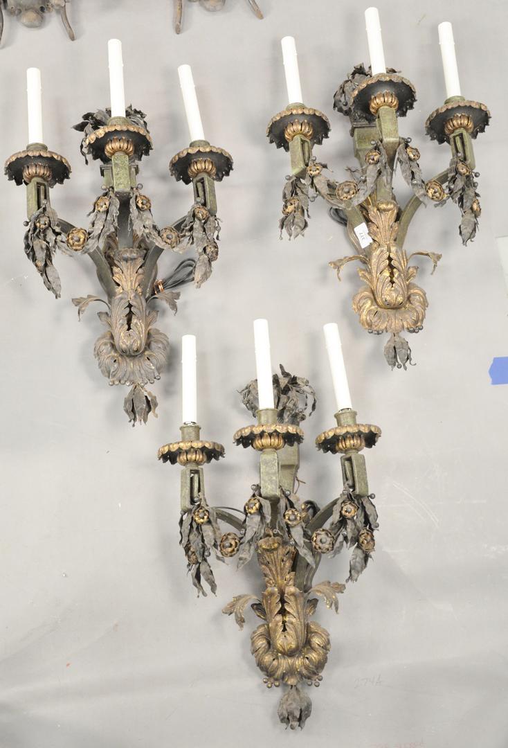 Group of Three Sterling Bronze Company Iron and Tole Wa: Group of Three Sterling Bronze Company Iron and Tole Wall Sconces, each having three lights and foliate decoration, length 25 1/2 inches, width 15 inches.