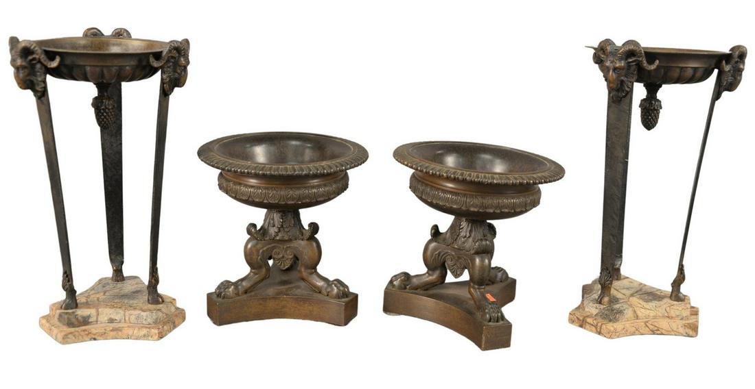Two Pairs of Bronze Grand Tour Urns, one pair having: Two Pairs of Bronze Grand Tour Urns, one pair having mounted ram heads and ending in hoofed feet, mounted on marble bases; along with a pair ending in paw feet and on bronze bases, 11" x 5 1/2" and 6 