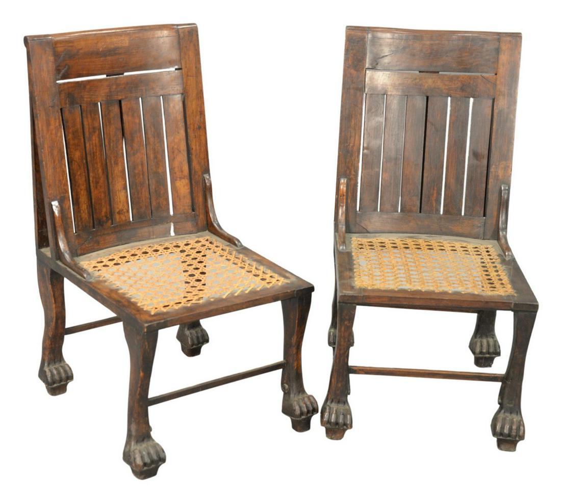 Pair of Egyptian Revival Side Chairs, having caned: Pair of Egyptian Revival Side Chairs, having caned seats and paw feet, height 33 inches, width 16 inches, (seat height 14 inches).