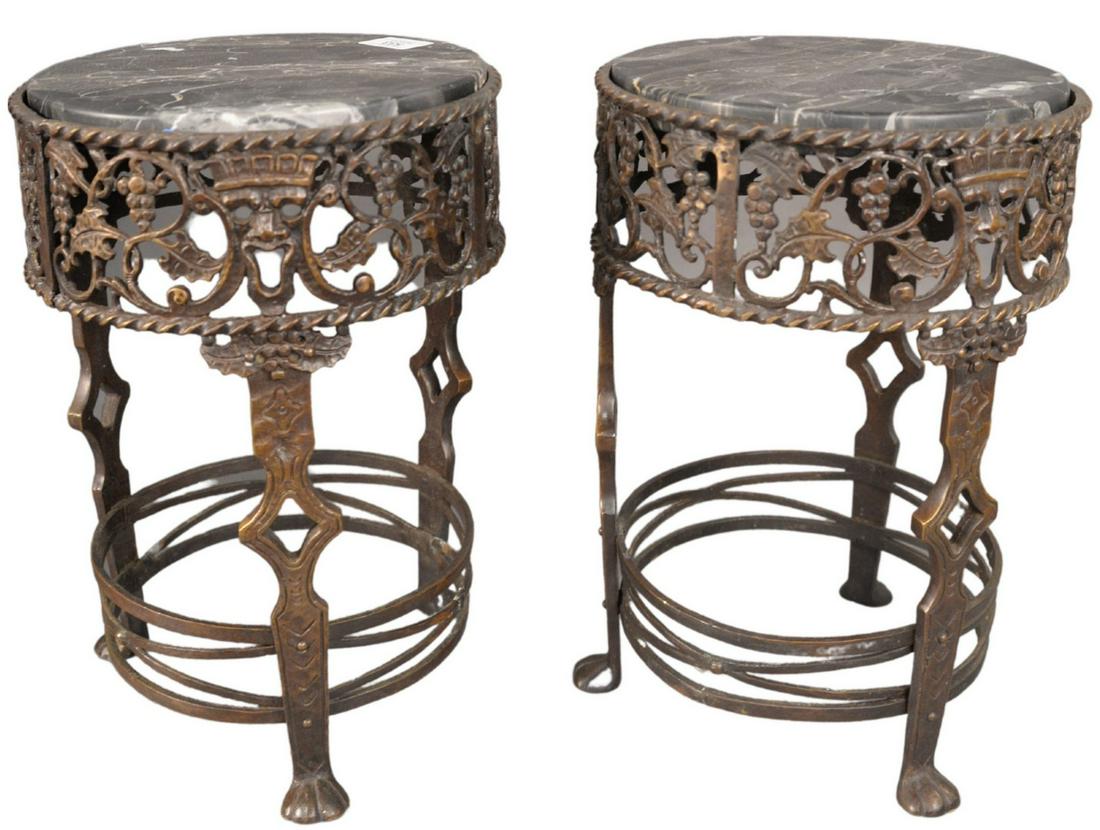 Pair of Oscar Bach Bronze and Marble Pedestals, one: Pair of Oscar Bach Bronze and Marble Pedestals, one marble repaired, height 14 inches, diameter 10 inches.