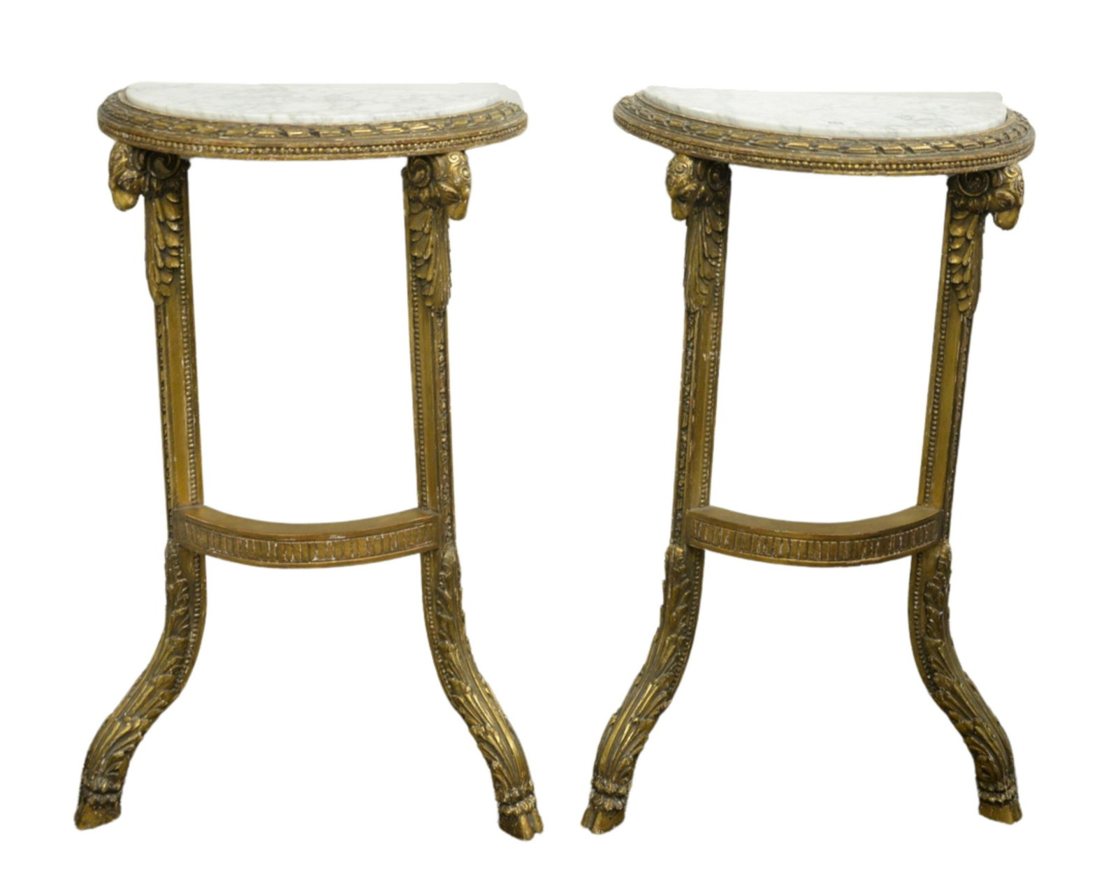 Pair of Marble Top Wall Mounted Demilune Tables, having: Pair of Marble Top Wall Mounted Demilune Tables, having carved rams head gilted base, height 32 inches, width 18 1/2 inches, depth 9 1/2 inches.