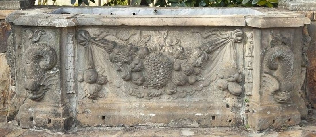 Five Part Limestone Garden Wall, having dolphin and put: Five Part Limestone Garden Wall, having dolphin and putti ends, wall with fruit, 18th century or earlier, (extremely heavy, several hundred pounds/no delivery, not currently assembled) largest slab he