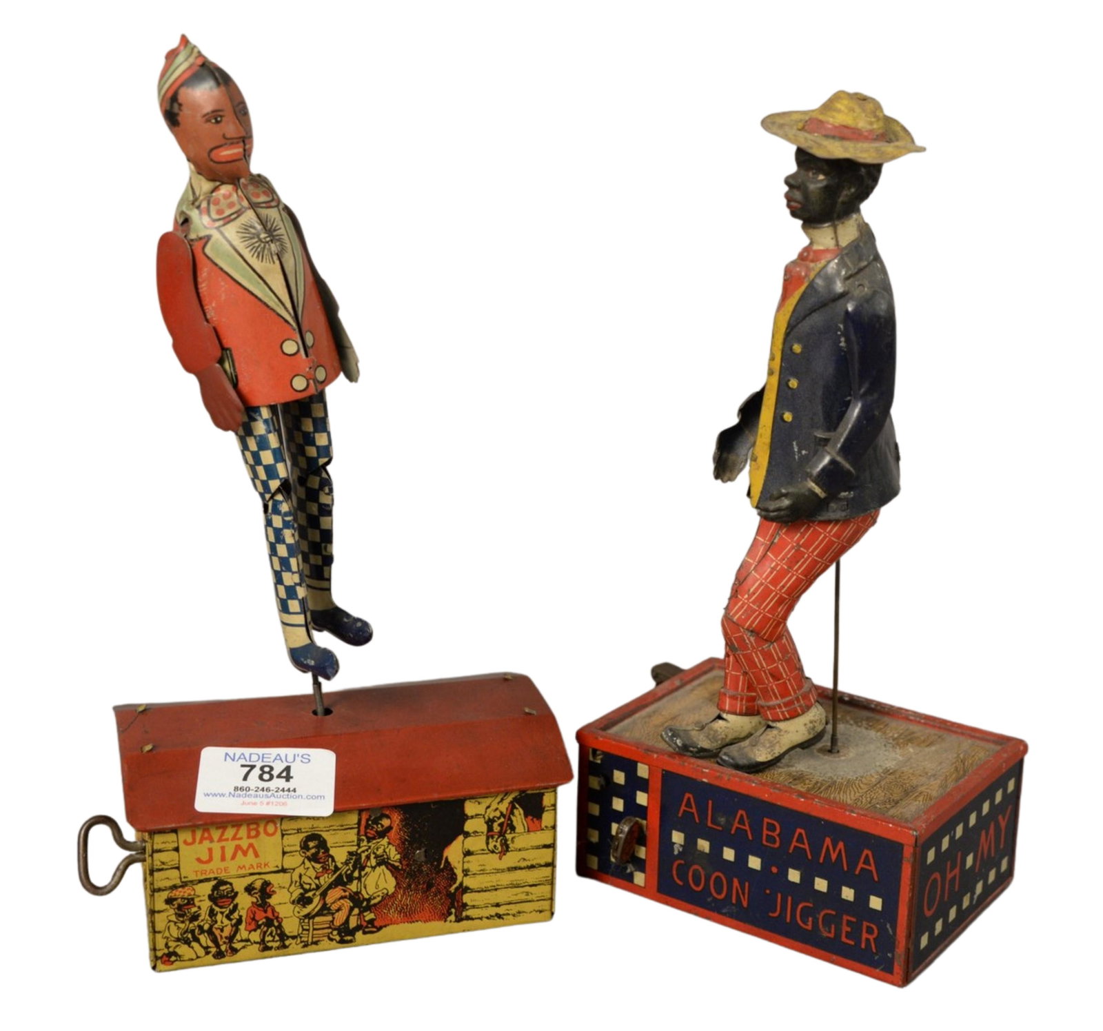 Two Black American Wind-up Dancers, marked 'Lehmann: Two Black American Wind-up Dancers, marked 'Lehmann Alabama Coon Jigger'; along with Jazzbo Jim, height 10 inches.