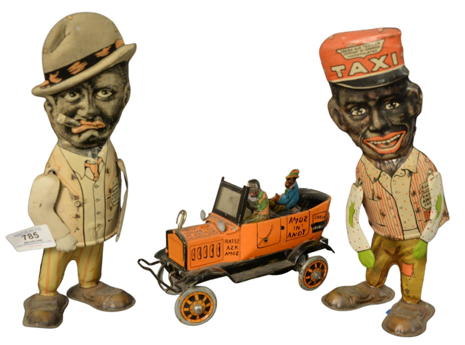 Three Marx Painted Tin Amos and Andy Wind Up Black: Three Marx Painted Tin Amos and Andy Wind Up Black Americana Toys, to include pair of walking Amos and Andy flat eye, height 11 1/2 inches; along with a Fresh Air Taxi Cab, length 8 inches.