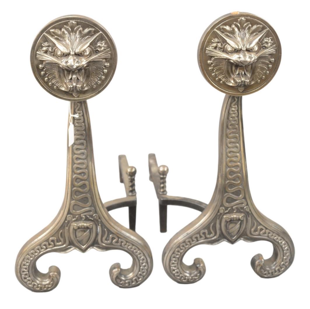 Pair of Iron Andirons with Lion Faces, height 24: Pair of Iron Andirons with Lion Faces, height 24 inches.