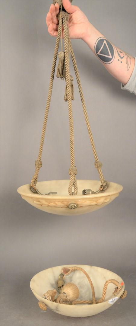 Two French Art Deco Style Hanging Dome Lights, both: Two French Art Deco Style Hanging Dome Lights, both carved alabaster, one having one light, the other having three lights, diameters 12 and 14 inches.