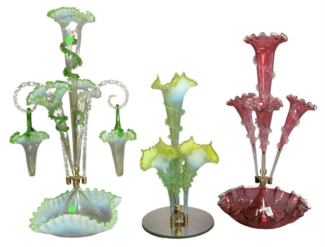 Three Victorian Epergnes, to include one cranberry,: Three Victorian Epergnes, to include one cranberry, tallest height 23 inches. Provenance: Estate of James Wadhams